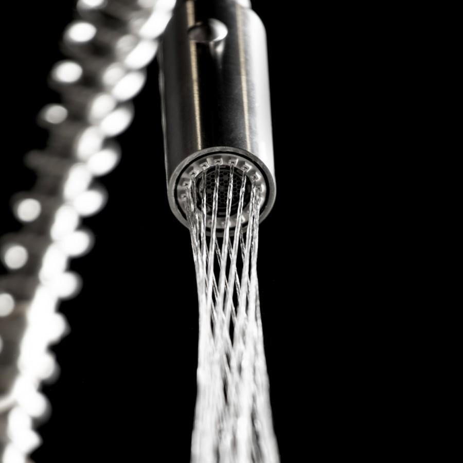 Matte black kitchen faucet aerator releasing a steady water stream