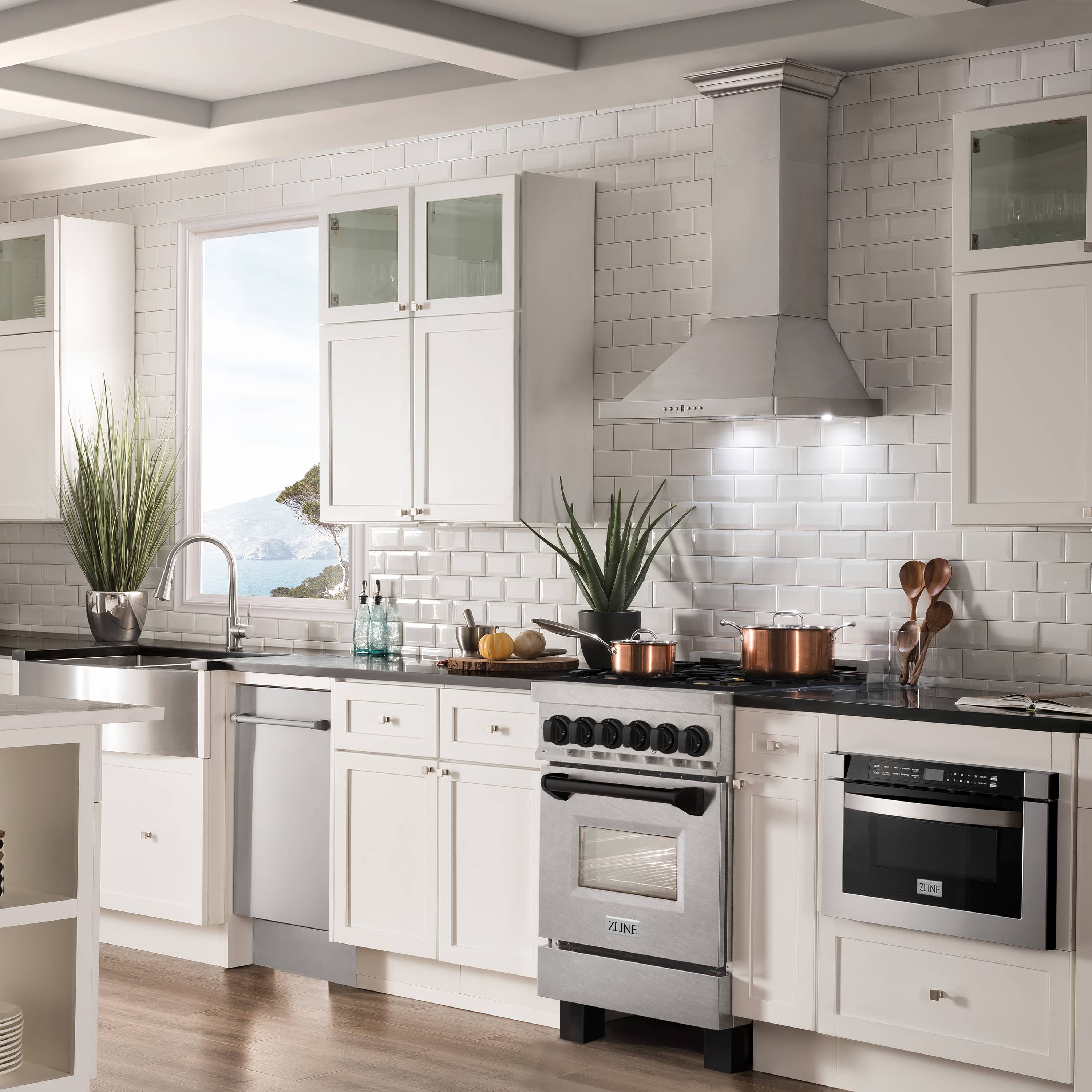 Dual fuel range in a modern kitchen with black and stainless oven doors
