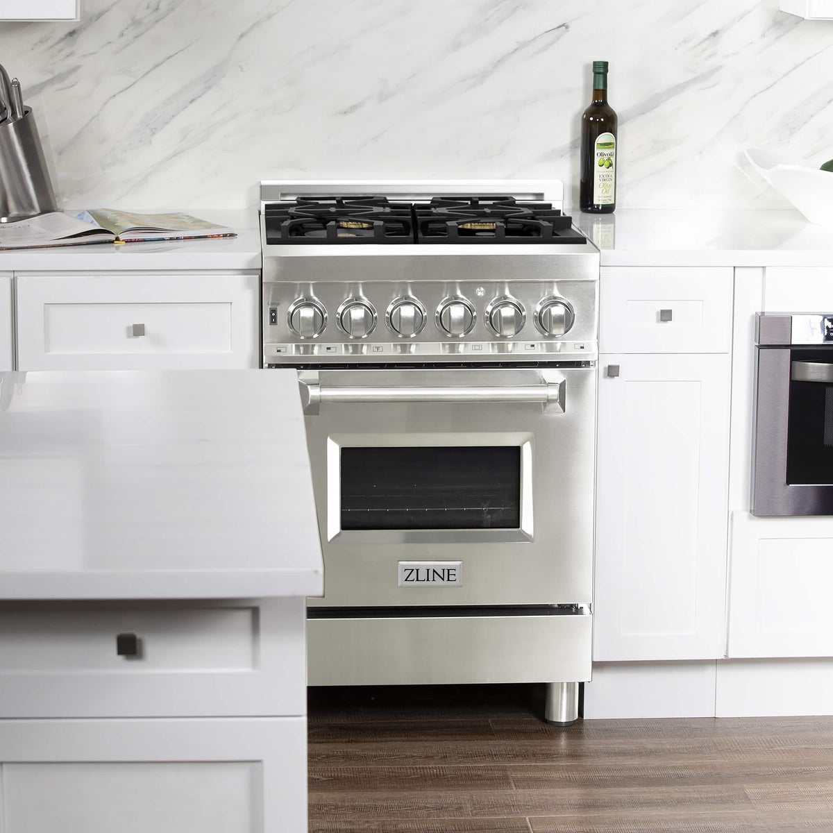 Stainless steel dual fuel range front view with burner grates and oven door