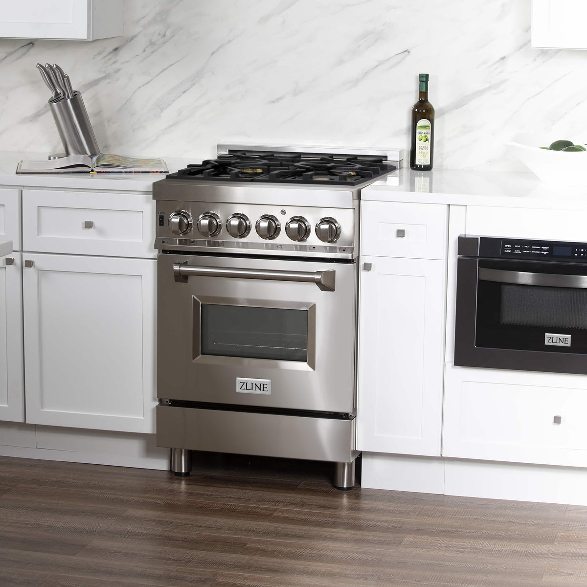Stainless steel dual fuel range with control panel, cooktop grates, and oven door