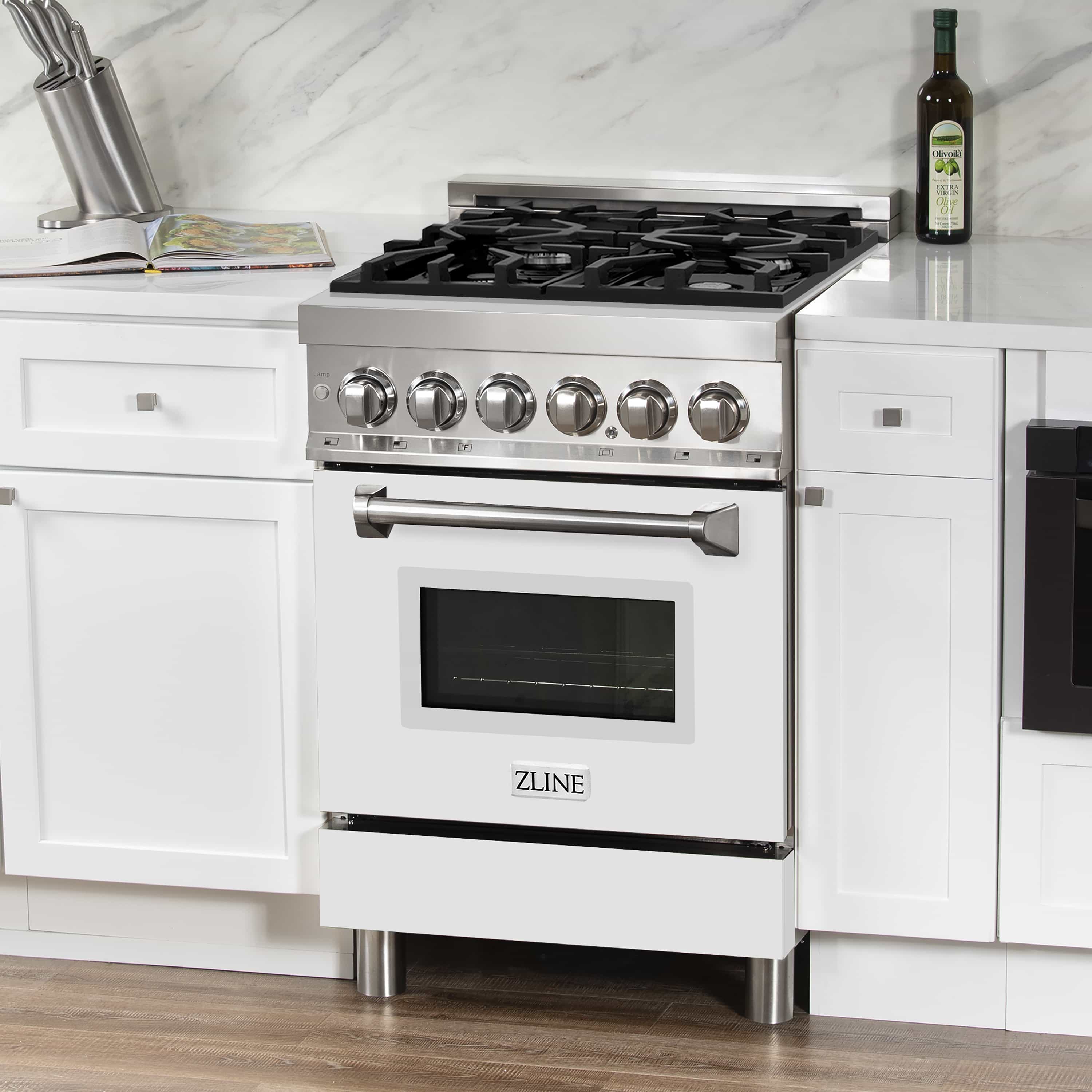 Stainless dual fuel range with white matte door, gas burners and control knobs.