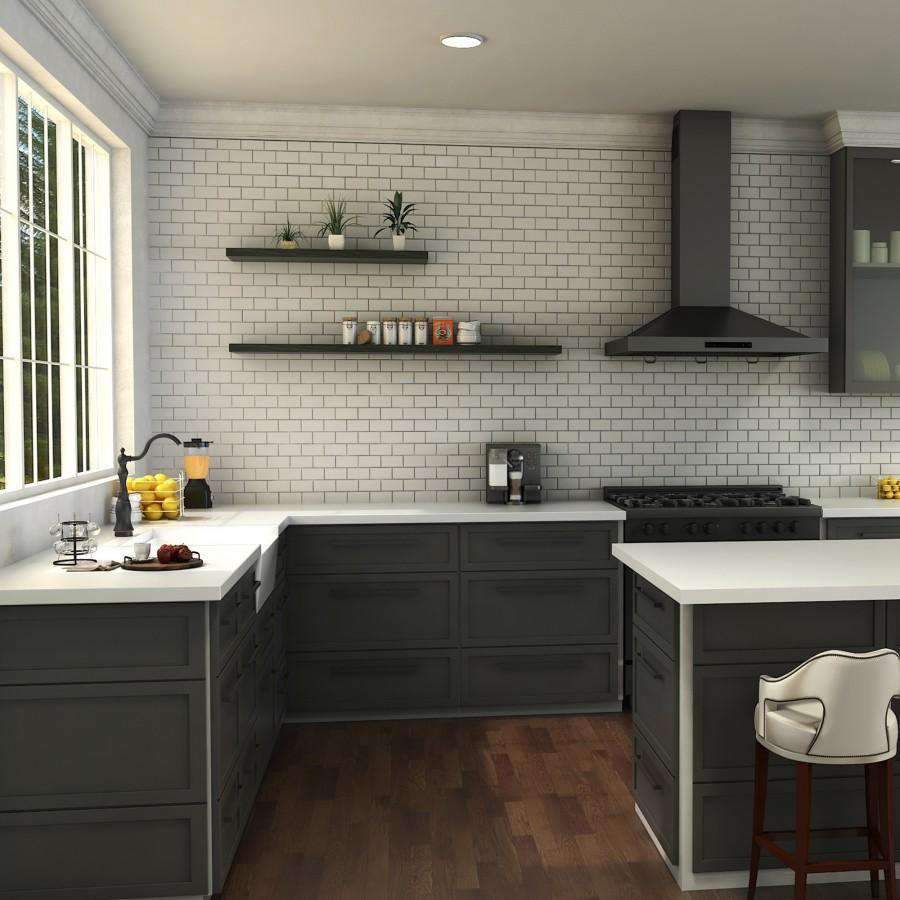 Oil-rubbed bronze kitchen faucet on a white countertop in a modern kitchen
