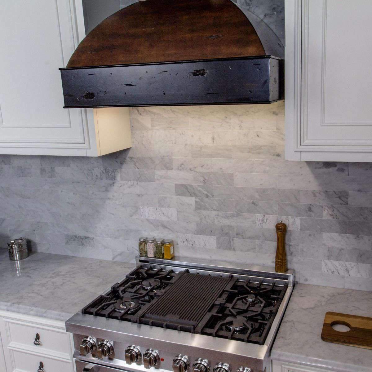 Reversible cast iron griddle insert with ridged surface on cooktop, dark gray