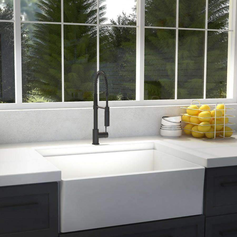 Matte black kitchen sink faucet with pull-down sprayer and arched spout