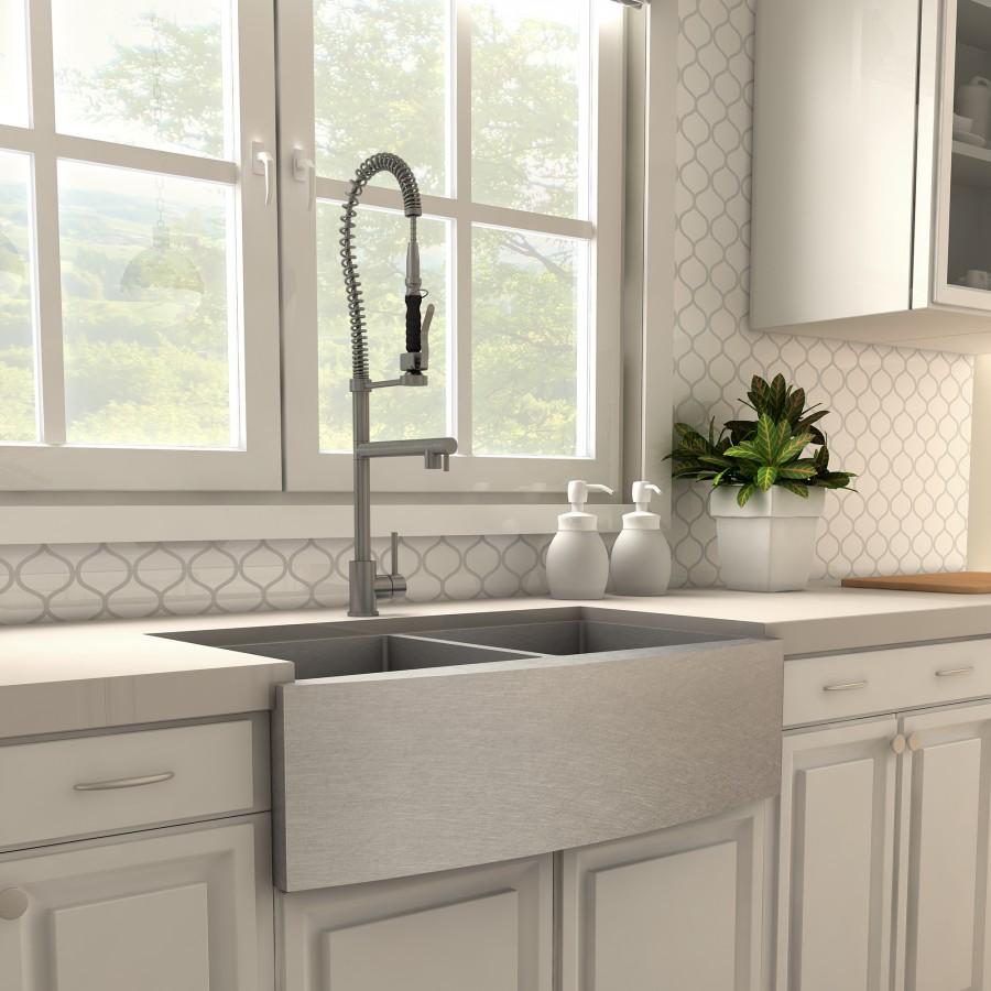 Gun metal kitchen faucet with tall arched spout, coiled spring sprayer hose, single handle