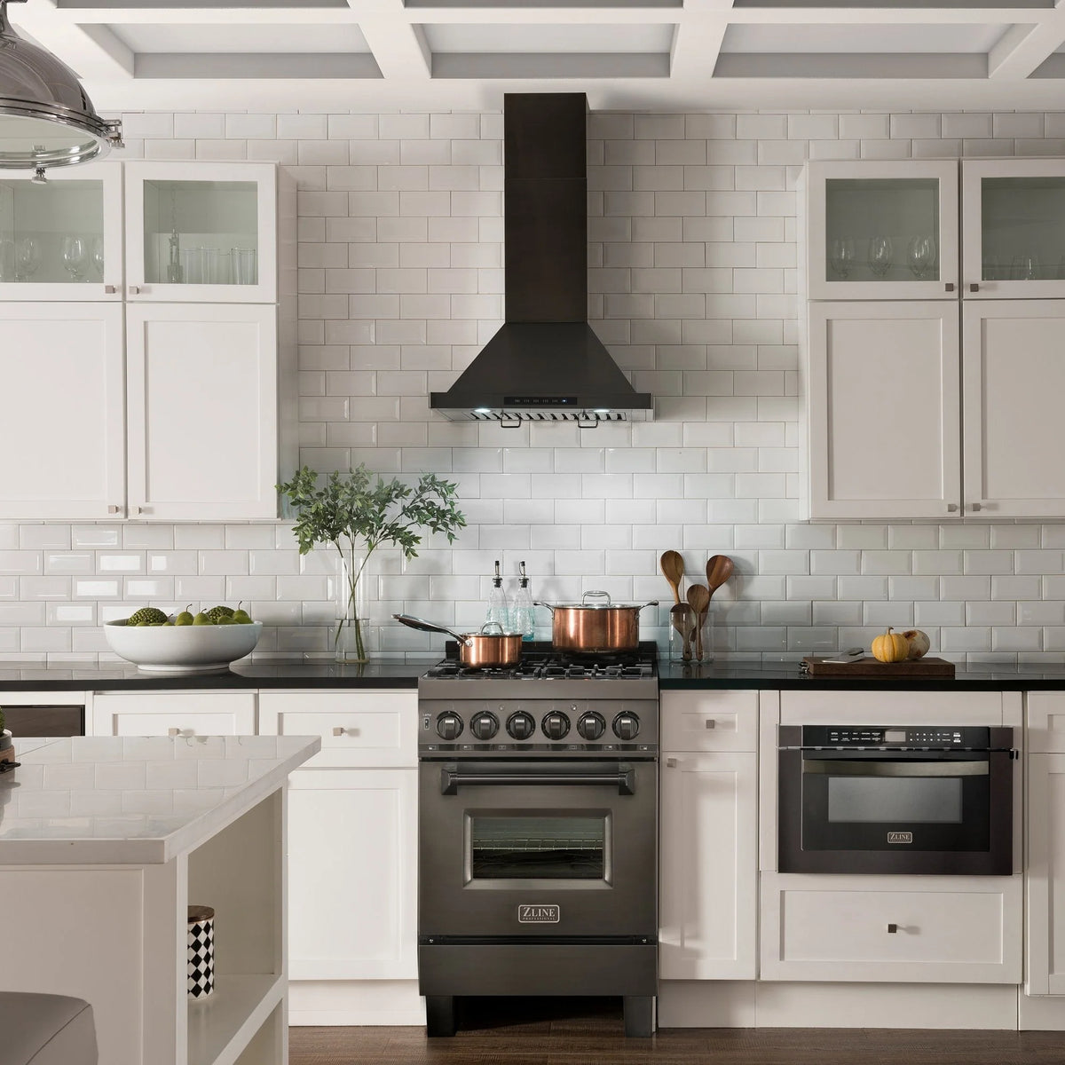 Black convertible wall mount range hood centered above kitchen cooktop